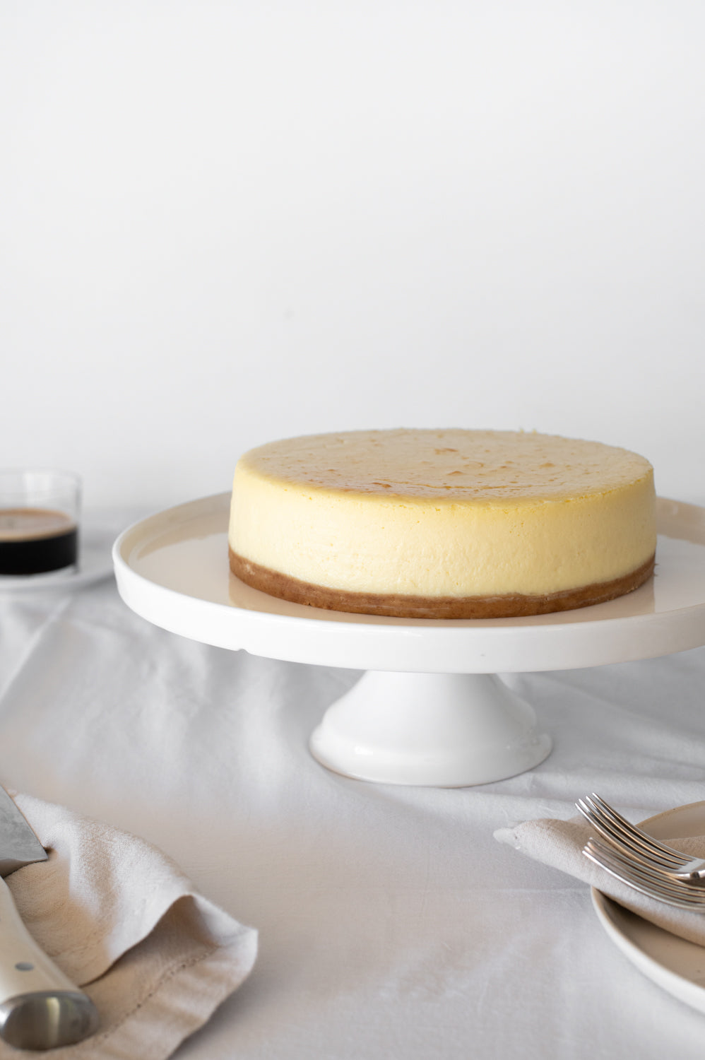 Plain Baked Cheesecake on a cake stand
