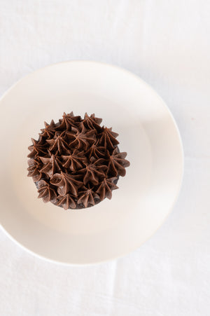 A top view of a chocolate cupcake