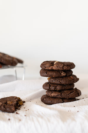 A stack of chewy triple choc chip cookies