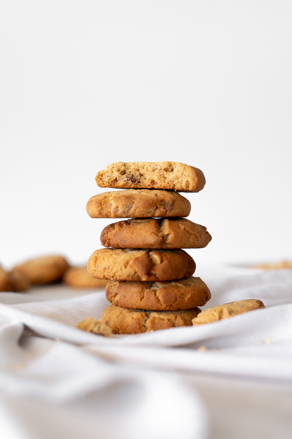 A stack of Peanut Butter and Choc Chip Cookies on a cloth