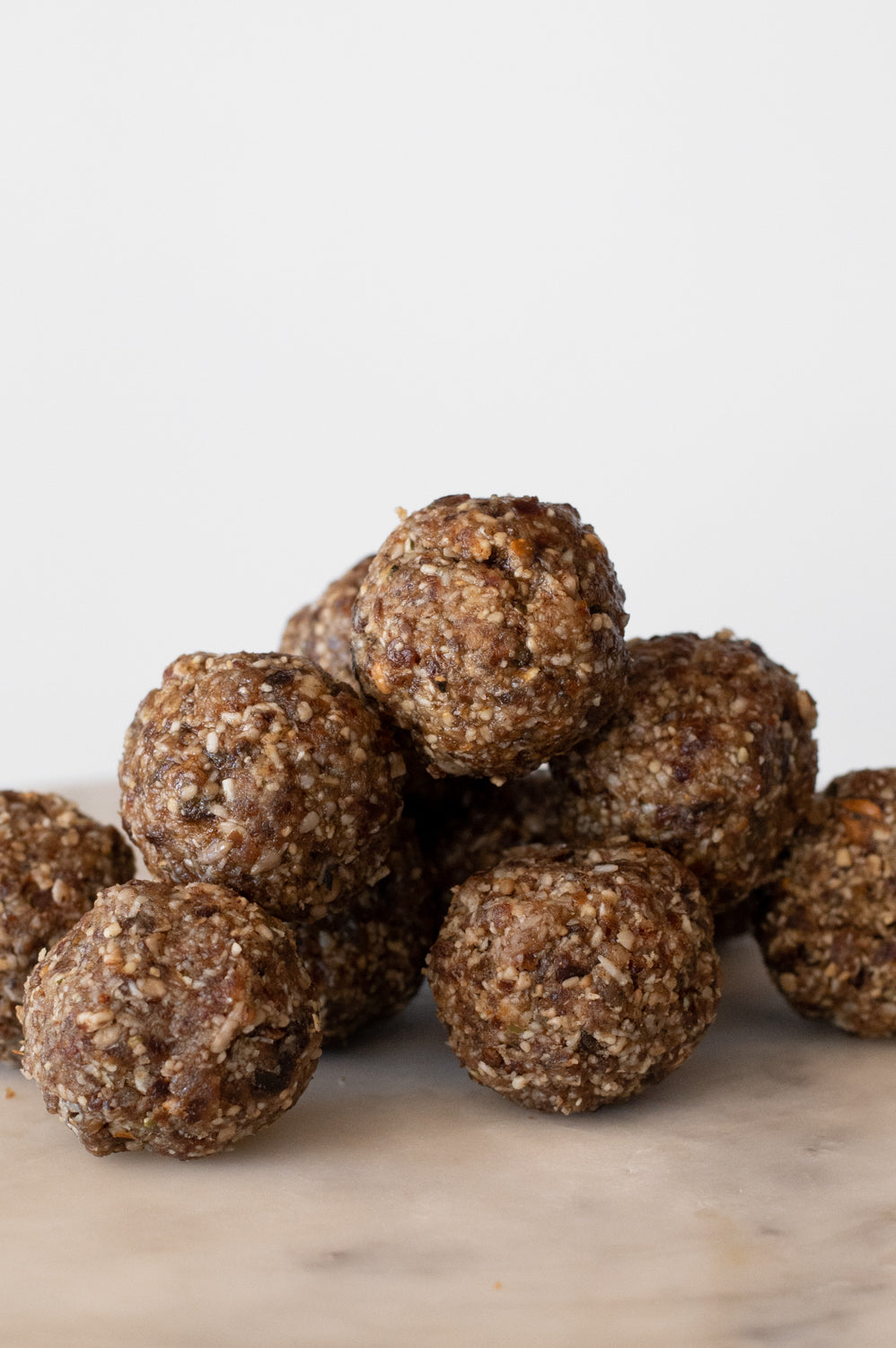 A pile of date balls on a plate