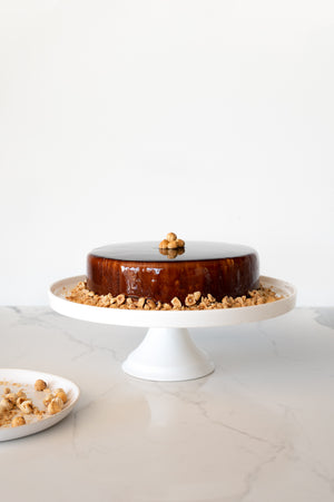 A Chocolate Hazelnut Mousse Cake on a cake stand